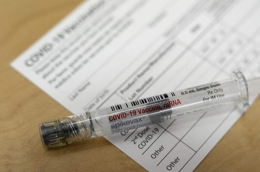 FILE - A Moderna Spikevax COVID-19 vaccine is seen at a drugstore in Cypress, Texas, Sept. 20, 2023.
