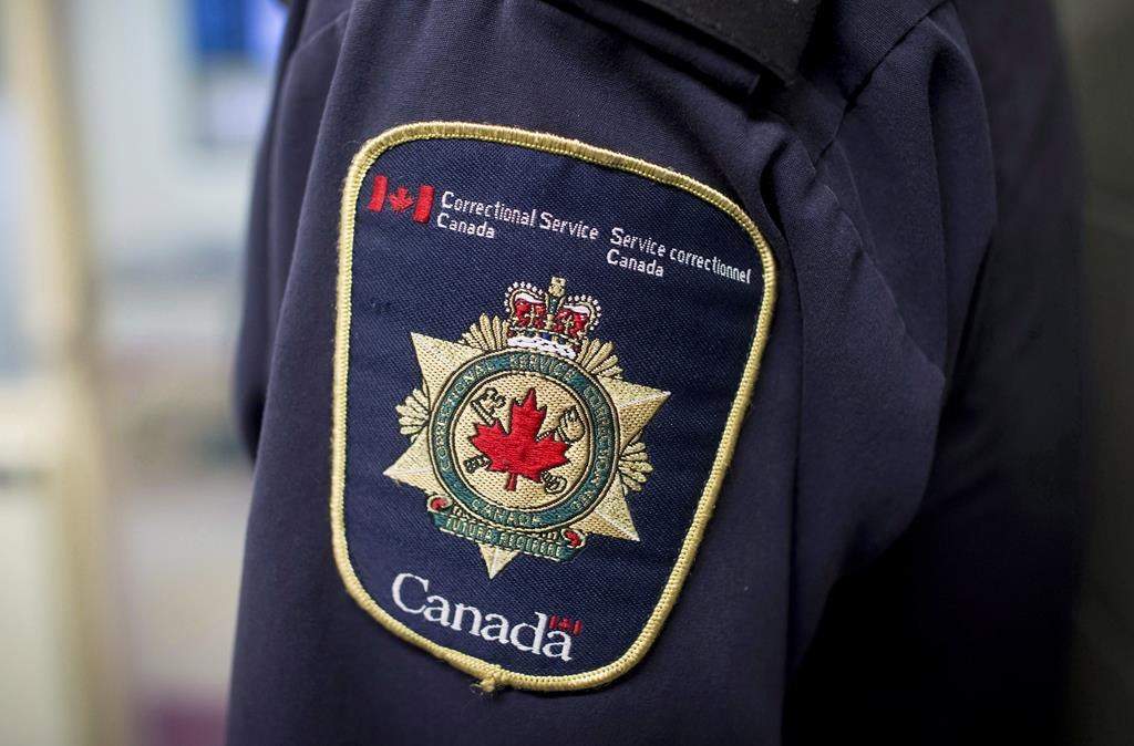 A father serving a life sentence for the second-degree murder of his son has been granted full parole and will be deported back to Jamaica, after serving over 20 years in prison. A patch is seen on the the shoulder of a corrections officer in Abbotsford, B.C., on Thursday October 26, 2017. 