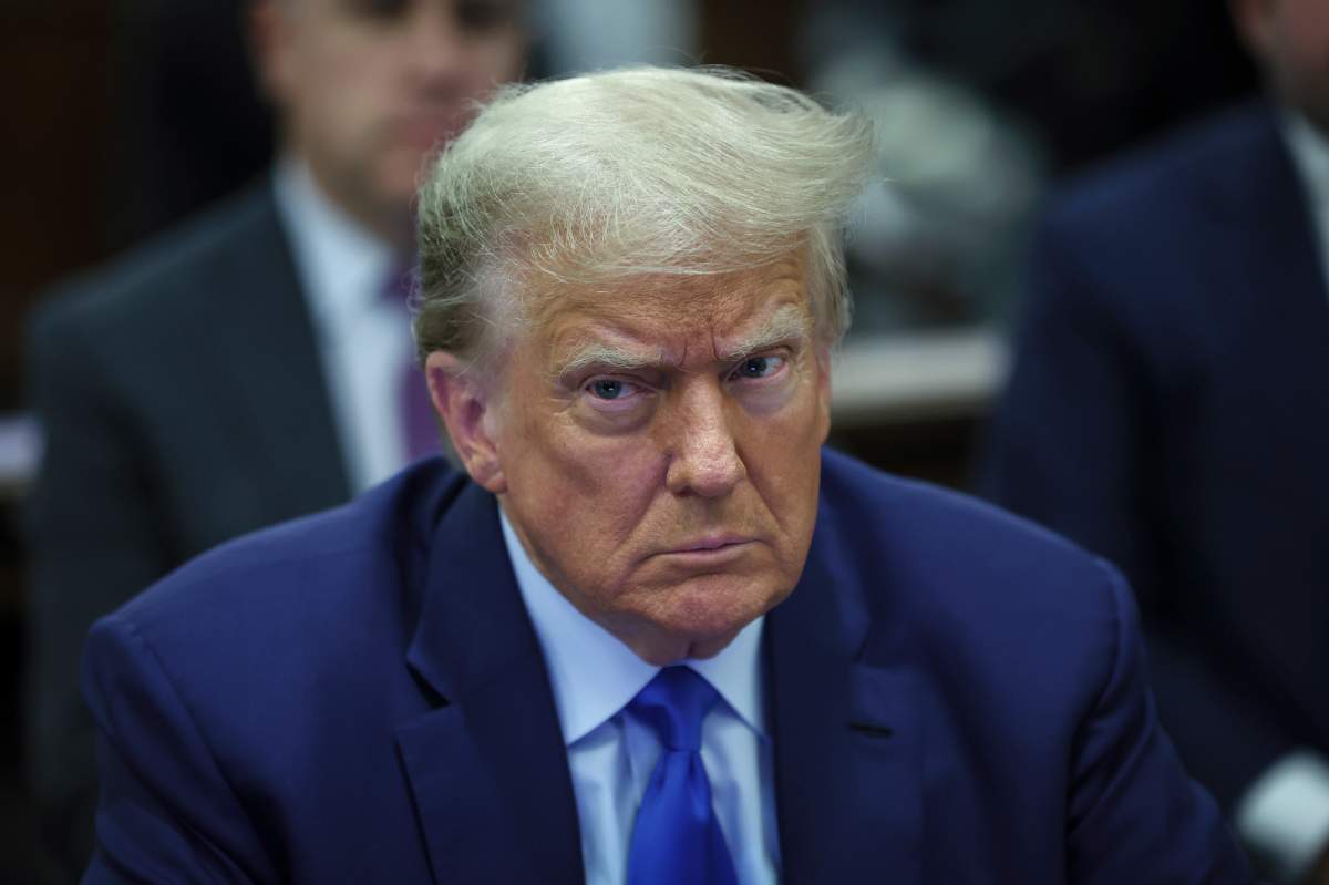Former President Donald Trump sits in the courtroom with his legal team before the continuation of his civil business fraud trial at the New York Supreme Court, Tuesday, Oct. 24, 2023, in New York. (Mike Segar/Pool Photo via AP)