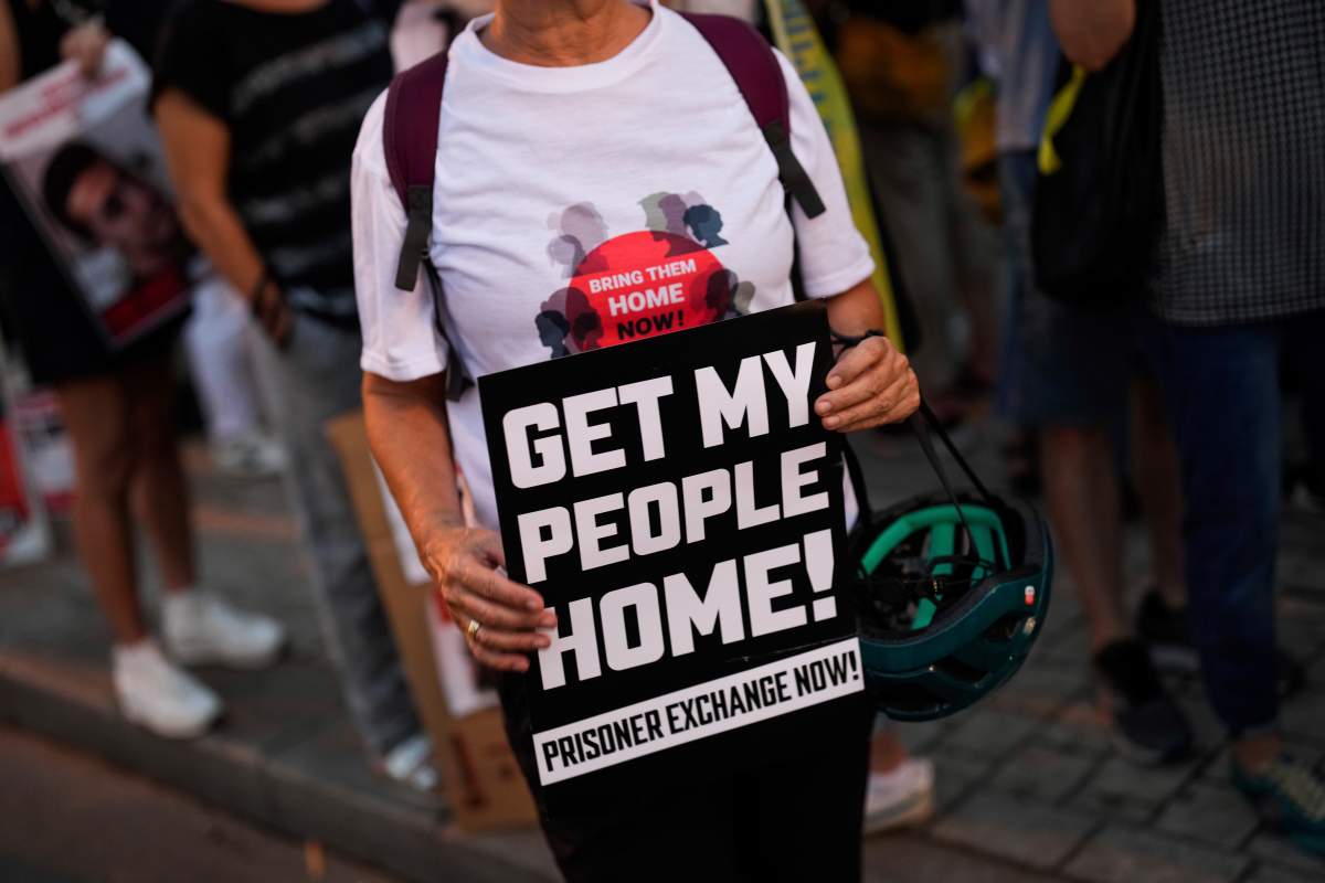 Israelis protest and call for the return of more than 220 people captured by Hamas militants, in Tel Aviv, Israel, Saturday, Oct. 28, 2023. (AP Photo/Bernat Armangue)