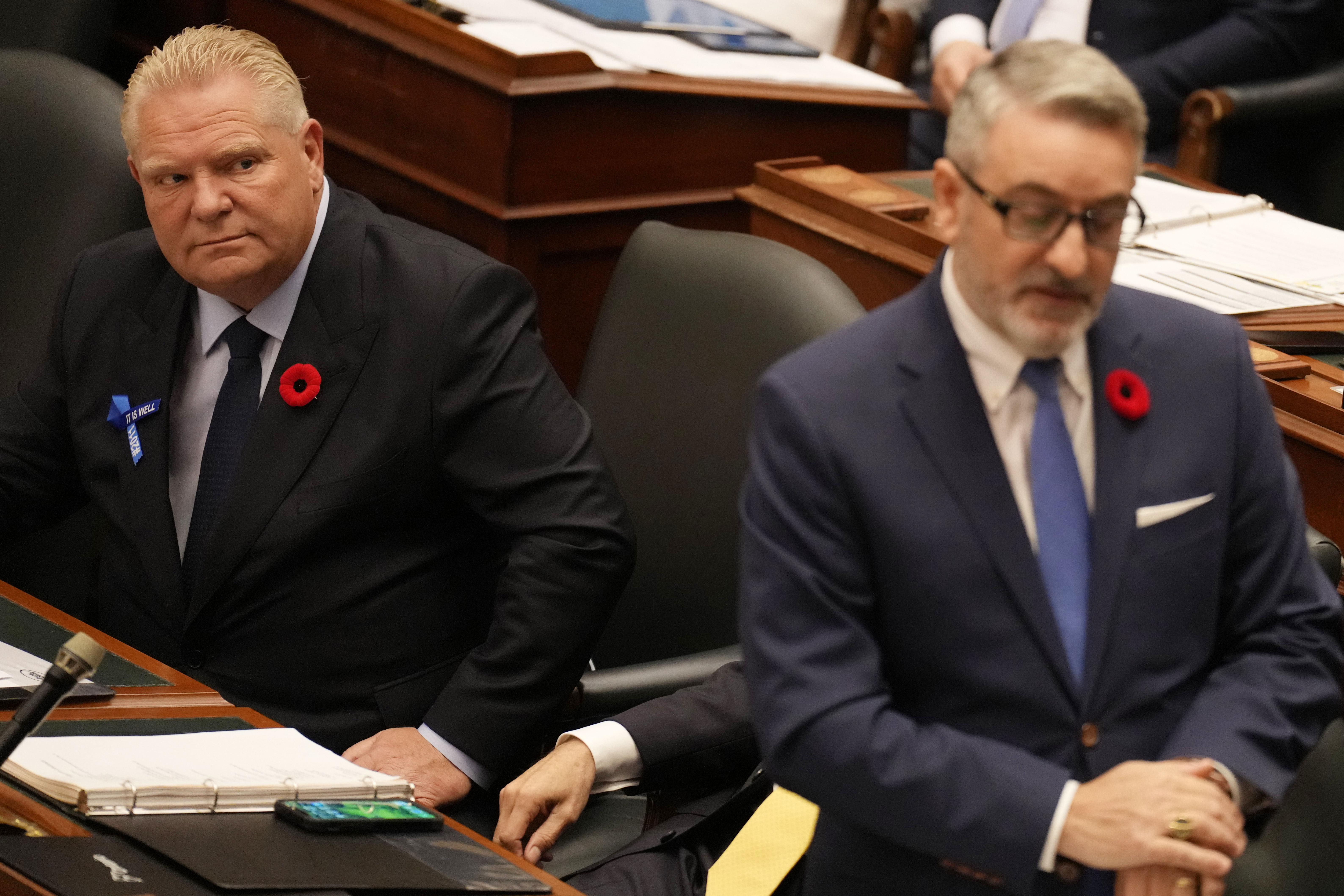 Ontario Premier Doug Ford, left, looks over at Minister of Municipal Affairs and Housing, Paul Calandra, at Queen's Park, in Toronto, Monday, Oct. 30, 2023. 