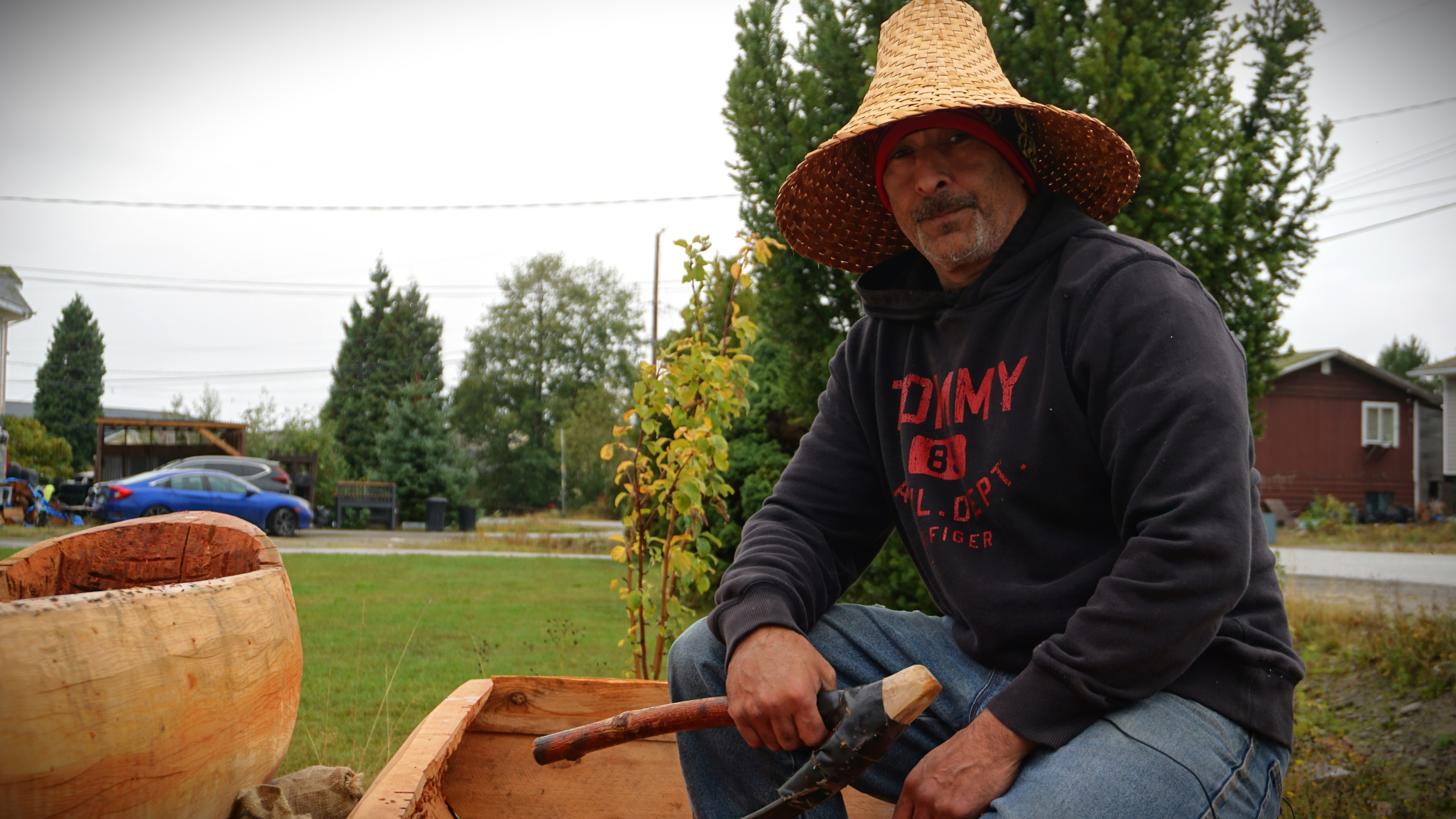 Tom Cordeiro sits in one of his practice canoes in Kitimaat Village, home of the Haisla Nation, on Sun. Oct. 1, 2023.