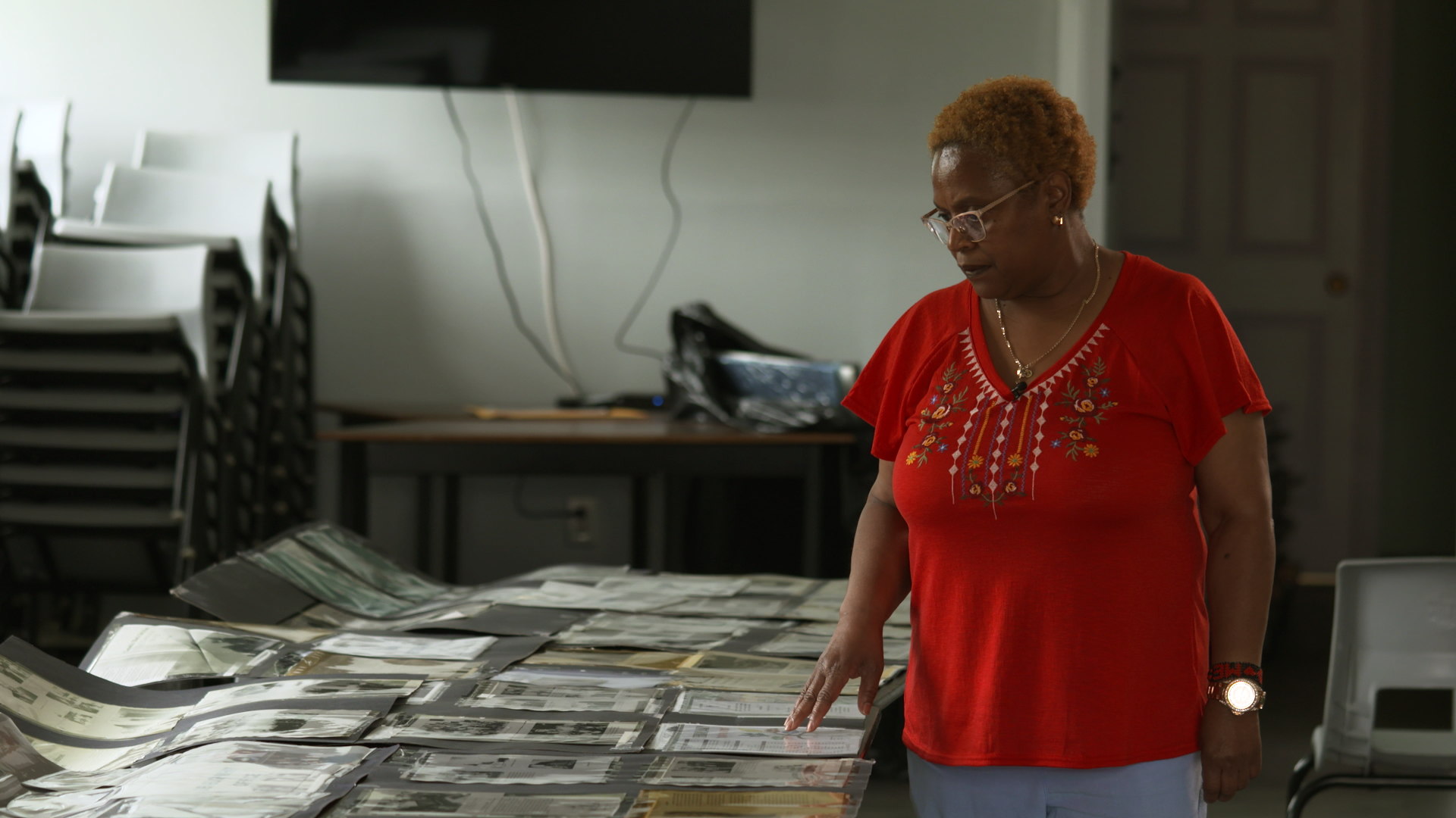 Gina Wilson-Jones looks at historical archives of Upper Hammond Plains at the local community centre. “We tend to get overlooked all the time, but we don’t let that keep us down,” she says.