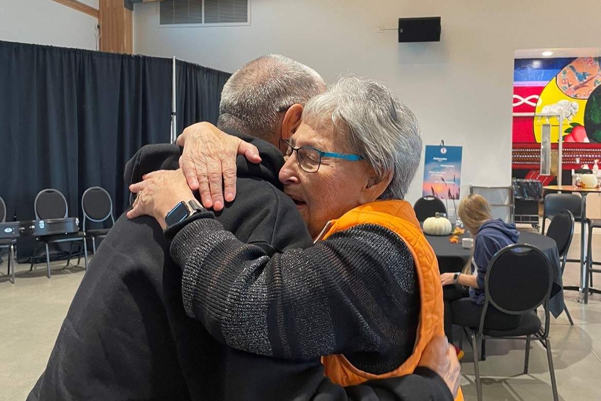two people hug