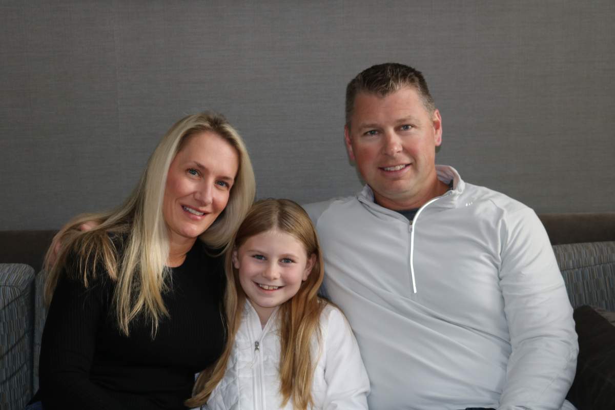 Grace Anstey, 10 with parents Melanie and David in London Ontario for knee surgery at Children’s Hospital at London. Oct. 18, 2023