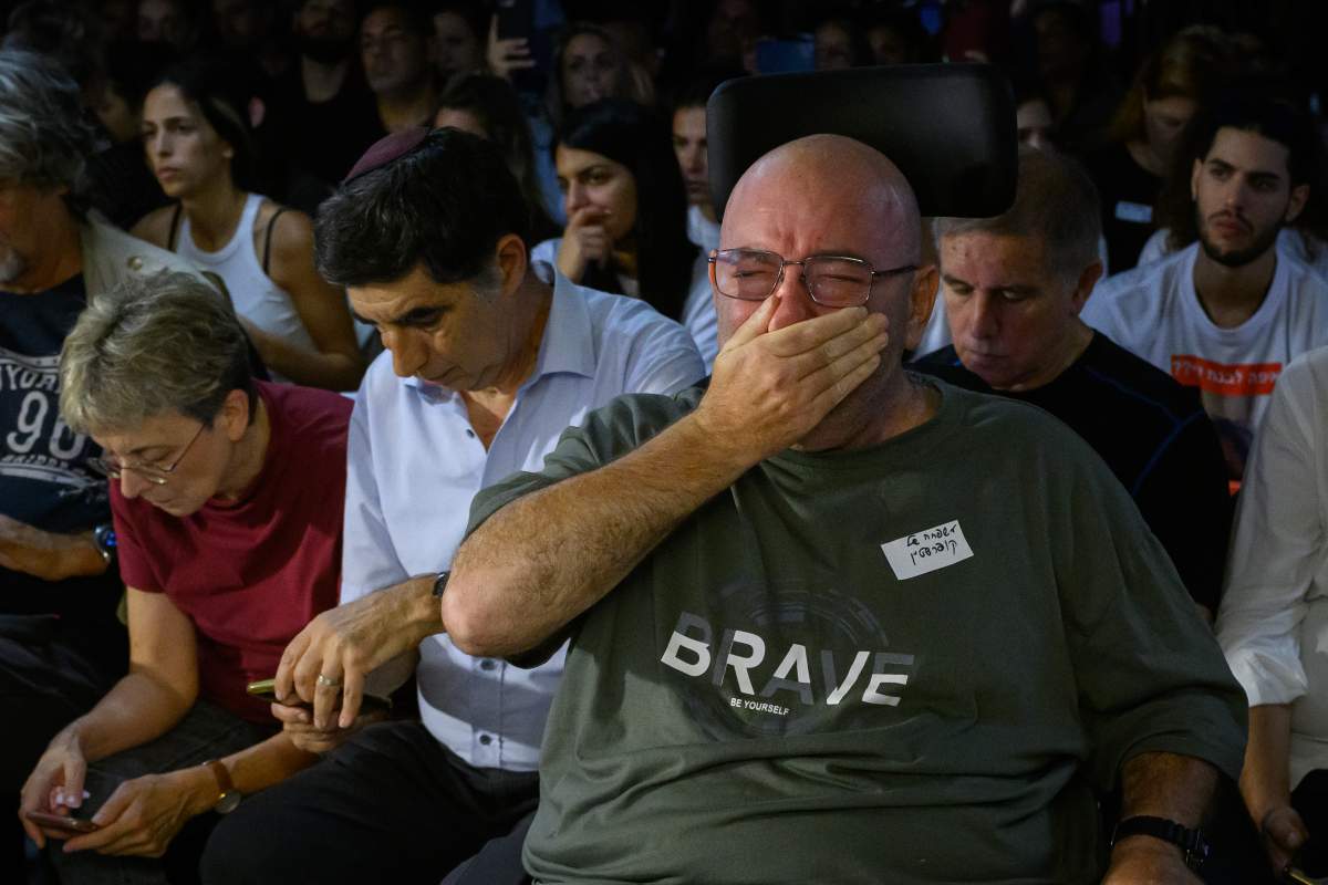 Family and friends of those taken hostage by Hamas during an attack on Israel react as they listen to speeches during a press conference on October 13, 2023 in Tel Aviv, Israel.