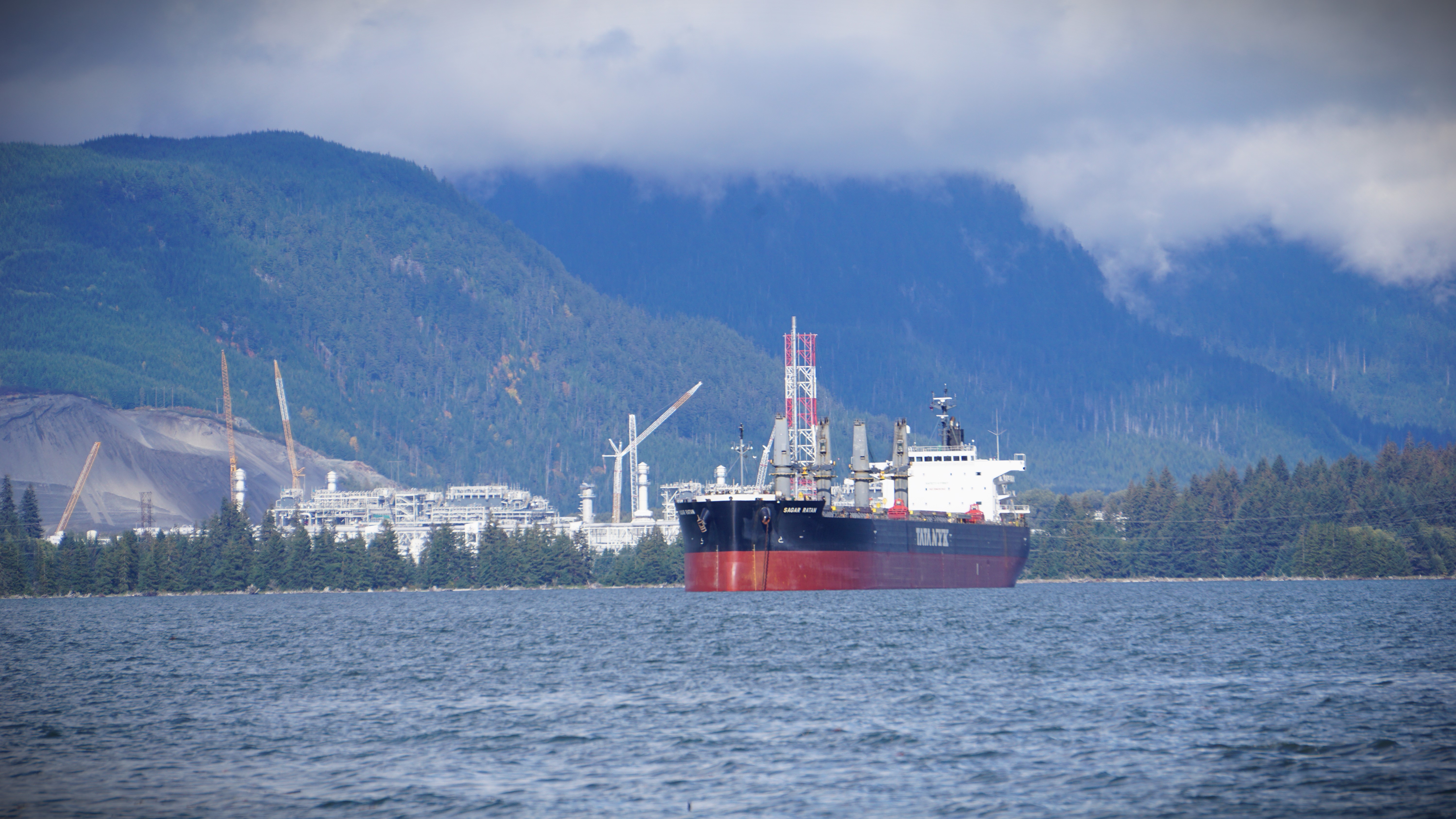 A tanker is seen in the deep water Douglas Channel in front of LNG Canada's construction site across from Kitimaat Village, B.C. on Thurs. Sept. 28, 2023.