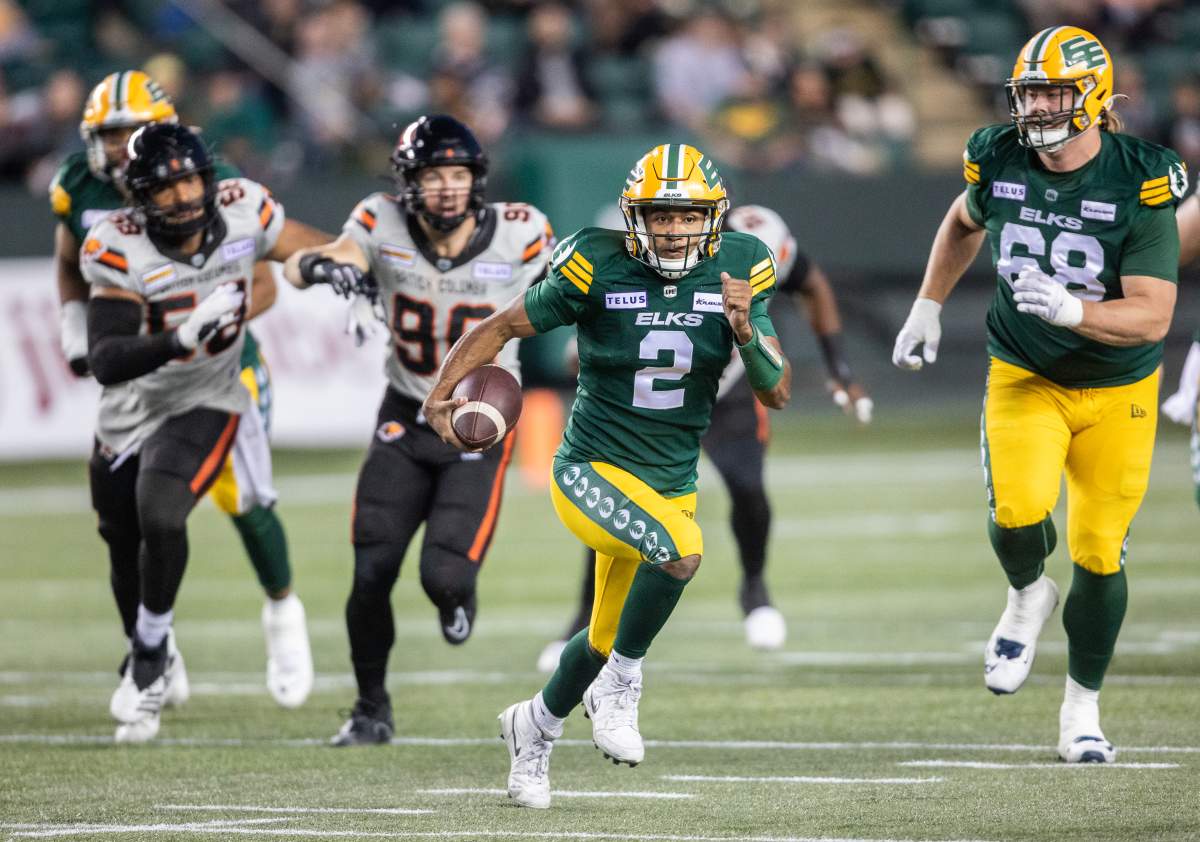 Elks quarterback Tre Ford escapes from the pocket against the B.C. Lions on Friday, September 22, 2023.
