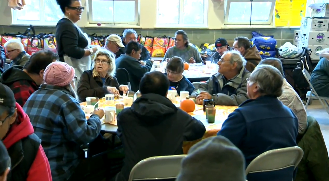 Volunteers serve meals at Agape Table in this file photo.