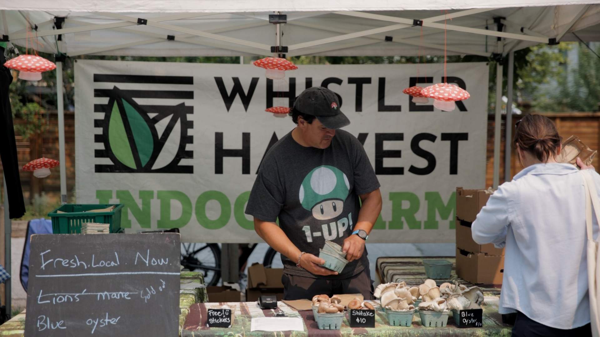 Paddy Smythe of Whistler Harvest selling his goods at a Vancouver farmer’s market.