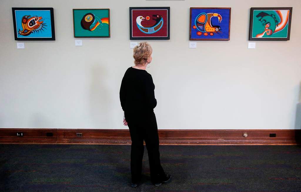 Former Speaker of the Manitoba legislature Myrna Driedger is photographed as she looks at some Jackson Beardy pieces in the new Indigenous art exhibit at the Manitoba legislature in Winnipeg Thursday, Nov. 9, 2023.