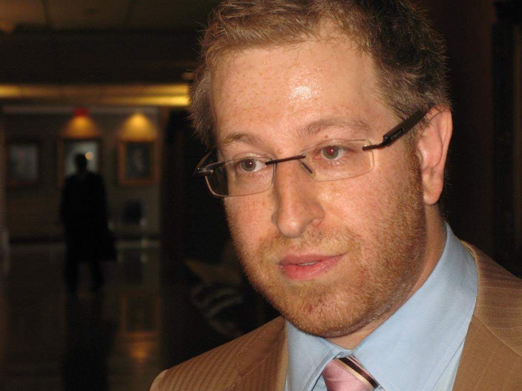 A lawyer representing dozens of women who say a Montreal billionaire paid them for sex while they were minors wants to freeze millions of dollars of the businessman's assets. Attorney Jeff Orenstein speaks with reporters Thursday, Aug. 8, 2013 outside a Montreal courtroom. 