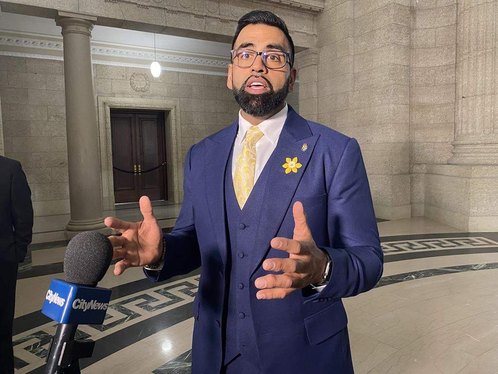 Progressive Conservative finance critic Obby Khan says a bill the Manitoba NDP government introduced to suspend the 14-cent-a-litre tax for at least six months is confusing. Khan says Manitobans deserve permanent tax relief. He is seen speaking to reporters at the Manitoba legislature in Winnipeg, Monday, April 4, 2022. THE CANADIAN PRESS/Steve Lambert.