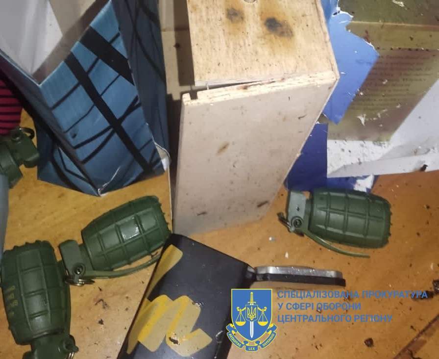 Photo of grenades and a gift bag lying on the floor, provided by the Special Prosecutor's Office of Ukraine's central division. On Nov. 6, 2023 a top Ukrainian army major died after setting off a grenade, gifted to him on his birthday, inside his home.