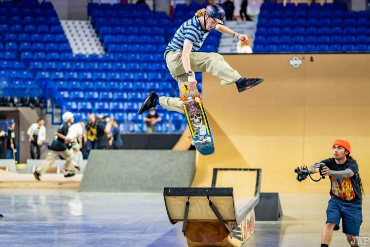 A person does a trick on a skateboard
