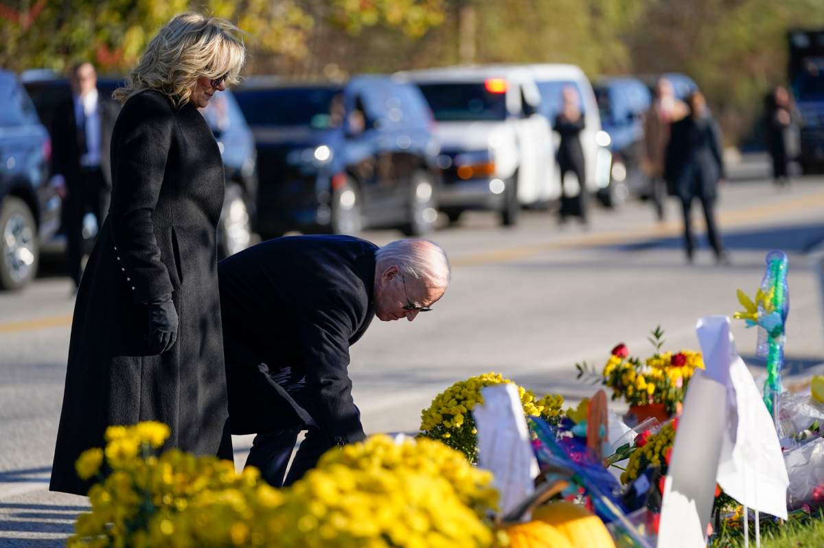 President Joe Biden and first lady Jill Biden lay flowers at Schemengees Bar and Grille, one of the sites of last week’s mass shooting, Friday, Nov. 3, 2023, in Lewiston, Maine. (AP Photo/Evan Vucci)