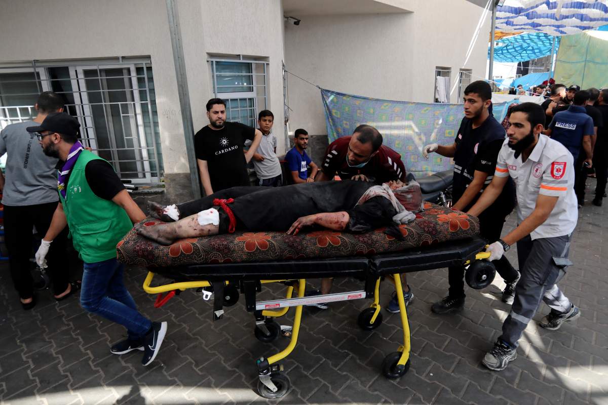 An injured Palestinian woman is wheeled into the al-Shifa hospital, following Israeli airstrikes on Gaza City, central Gaza Strip, Sunday, Nov. 5, 2023.