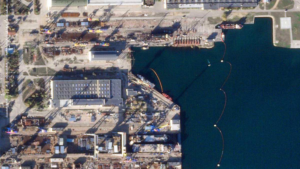 This satellite image from Planet Labs PBC shows a shipyard in Kerch in the Crimean Peninsula after a Ukrainian missile attack targeted the shipyard and a Russian naval vessel there Sunday, Nov. 5, 2023. Satellite photos analyzed Monday, Nov. 6, 2023, by The Associated Press showed damage done by a Ukrainian missile strike on a Russian navy corvette moored off Kerch in the Moscow-held Crimean Peninsula. (Planet Labs PBC via AP)