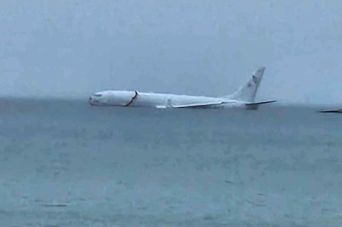 This photo provided by Diane Dircks shows a U.S. Navy plane that overshot a Marine base on Kaneohe Bay, Hawaii, Monday, Nov. 20, 2023.