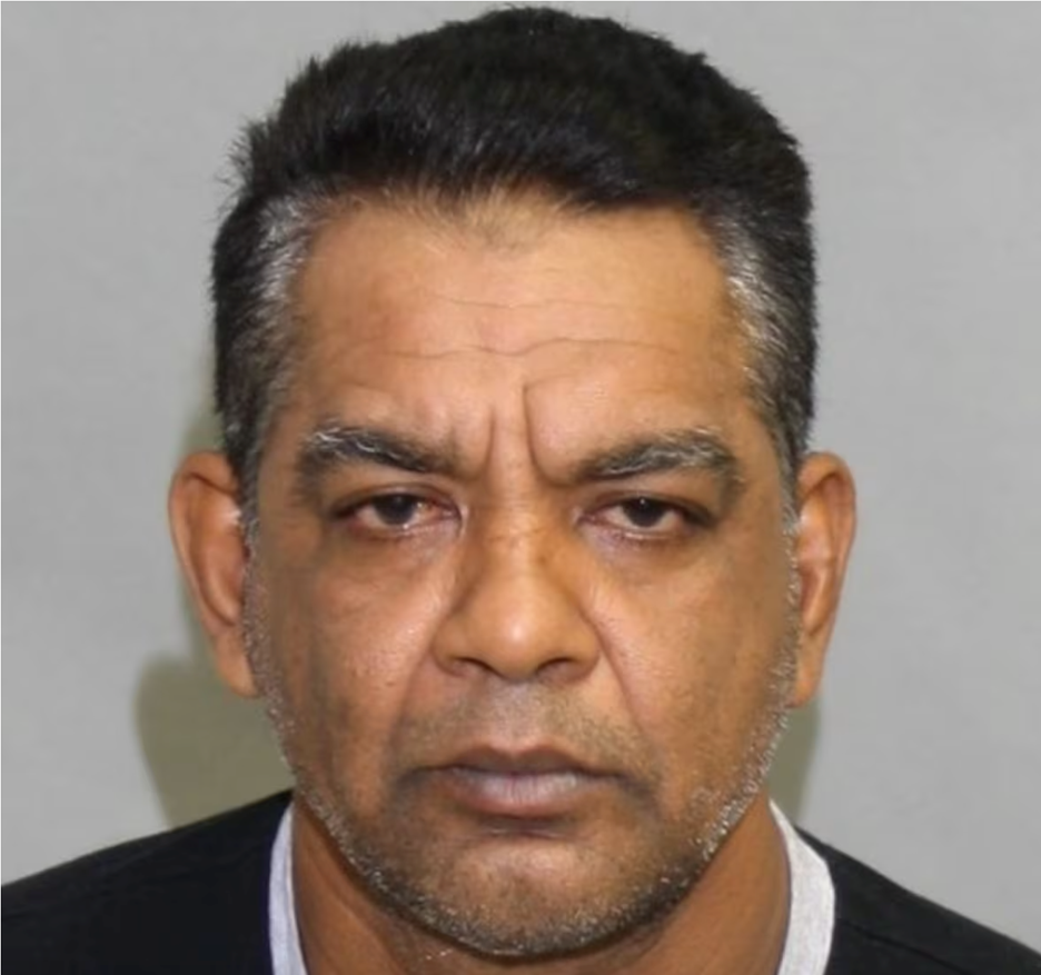 Harry Rajkumar is one of Canada's most wanted and is pictured staring directly into the camera.