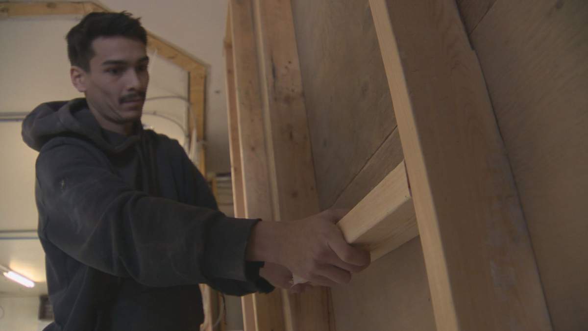 Alex Campbell works on a job site at Inner City Youth Alive.