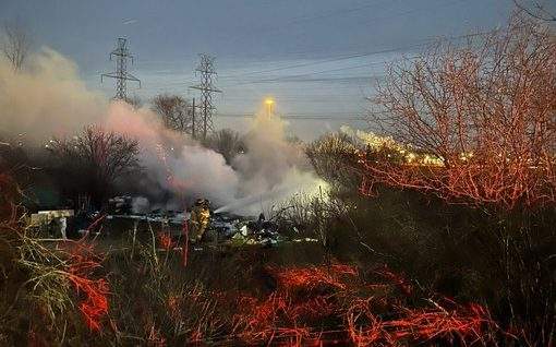 Fire crews in London, Ont., received multiple reports of a large encampment fire in the area of Adelaide Street South and Royce Court around 5:15 p.m. on Wednesday.