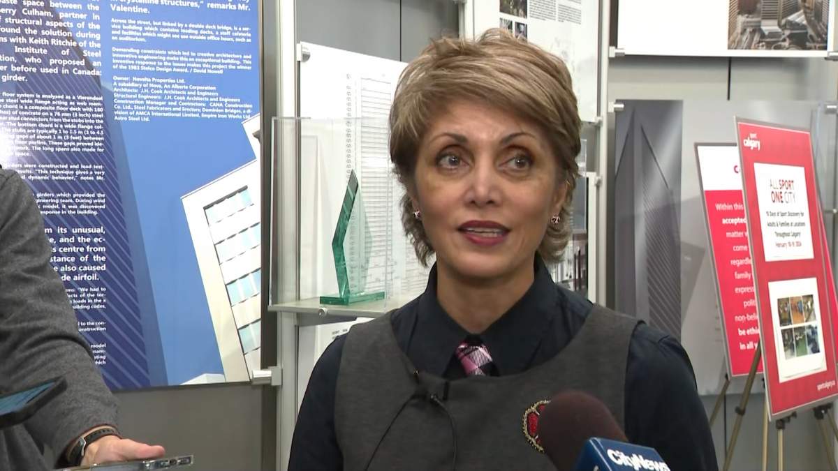 Calgary Mayor Jyoti Gondek speaks with reporters after announcing three more downtown conversion projects on Nov. 8, 2023.