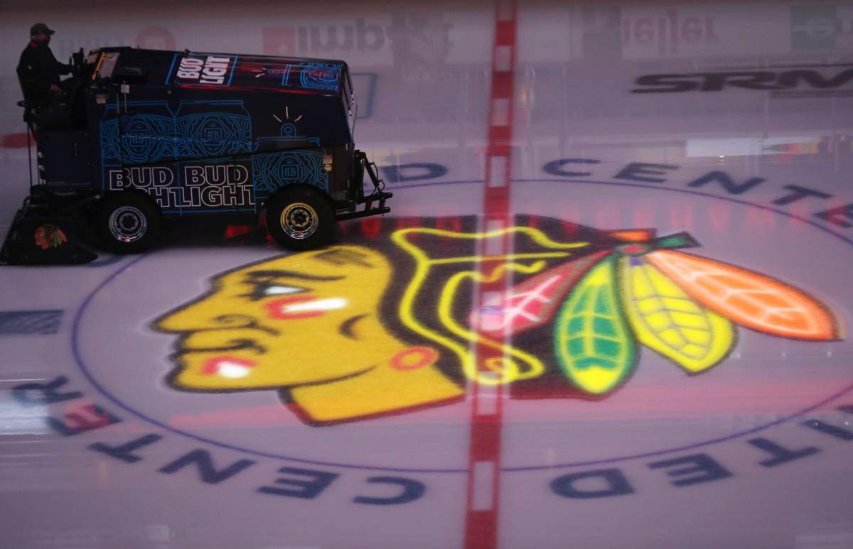 File - The Blackhawks logo is illuminated before a game against the Predators on April 23, 2021, at the United Center.