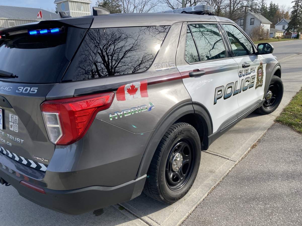 As the 26-year-old man was being taken out of the house on Tuesday night, Guelph police say he threatened one of the women living at the address.