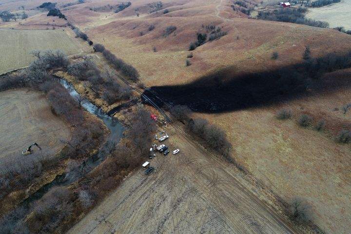 FILE - In this photo taken with a drone, cleanup continues in the area where the ruptured Keystone pipeline dumped oil into a creek in Washington County, Kan., Dec. 9, 2022. TC Energy, the operator of the Keystone pipline system, has finished cleaning up a massive December 2022 oil spill, and the creek affected by it is flowing naturally again, the company and the U.S. Environmental Protection Agency announced Tuesday, Oct. 31, 2023.