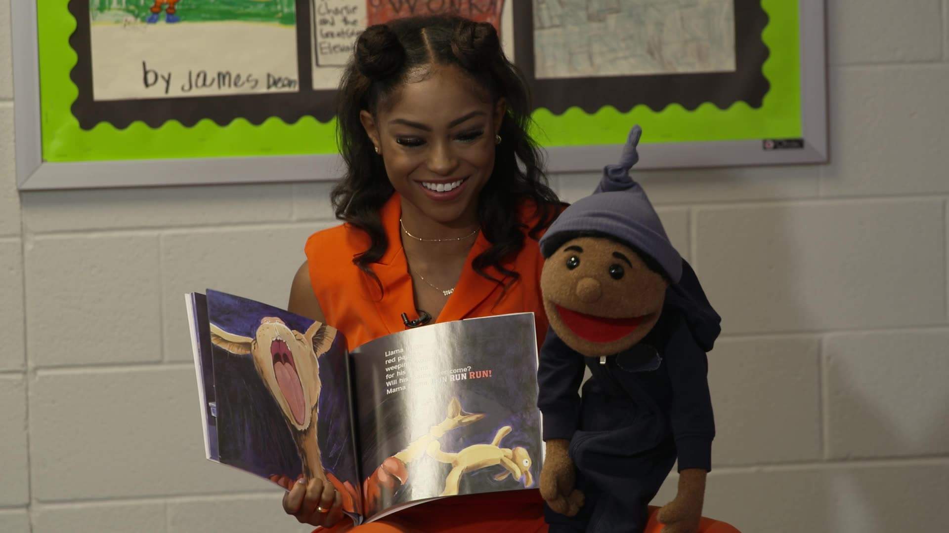 Megan Piphus, who is Sesame Street’s first full-time, Black, female puppeteer performs with her puppet, Junebug.