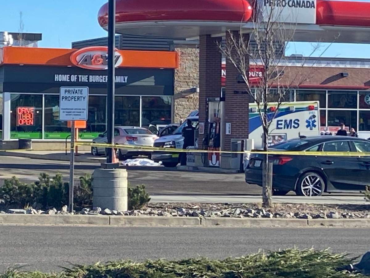 A police scene around a Petro-Canada gas station and A&W near Ellerslie Road and 50th Street in southeast Edmonton on Thursday, November 9, 2023.