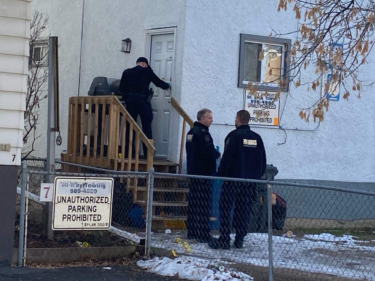 Winnipeg police at the scene of a homicide on Bannatyne Avenue Monday.