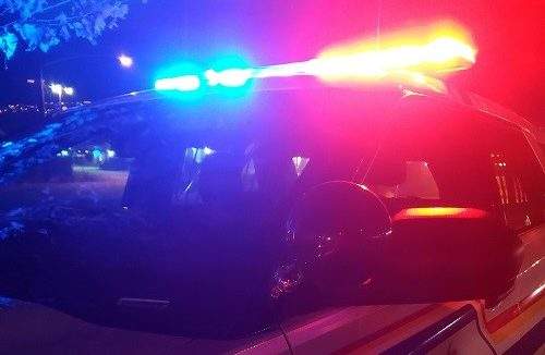 A police vehicle with its lights on.