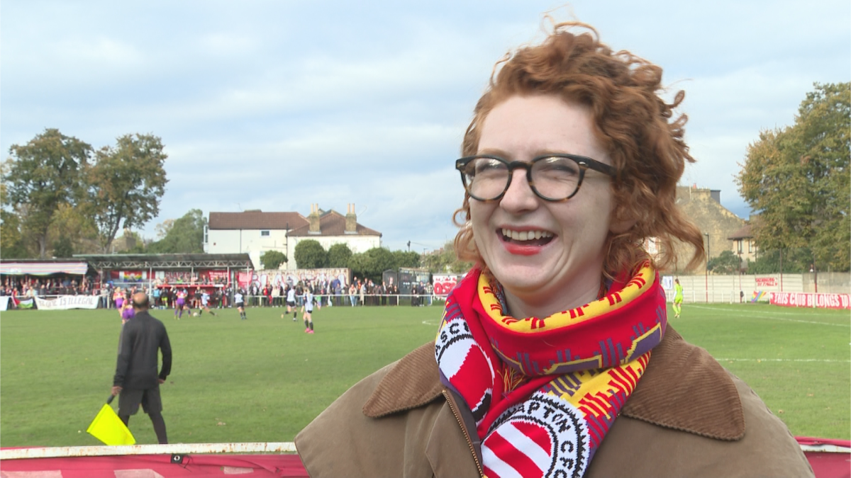 Beth Malcolm stands on the touchline of The Old Spotted Ground soccer stadium during a game between Clapton Community Football Club and Fulham FC.