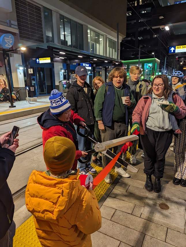 Passengers celebrate the opening of the Valley Line LRT.