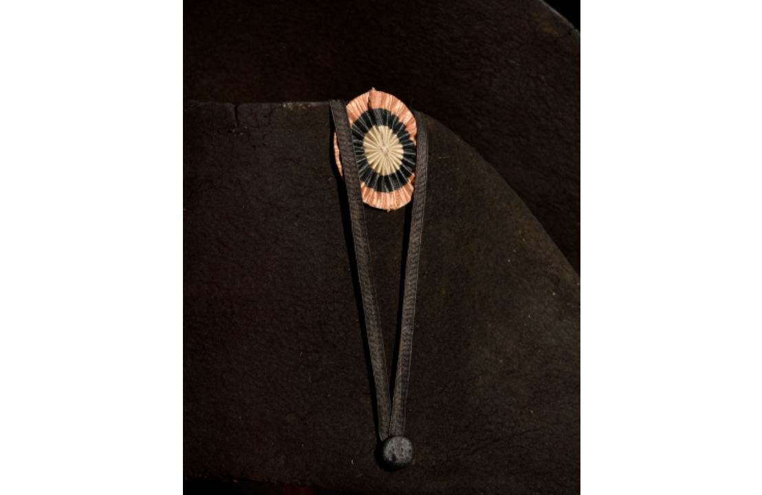 A tri-colour cockade adorning a bicorne hat owned by Napoleon Bonaparte.
