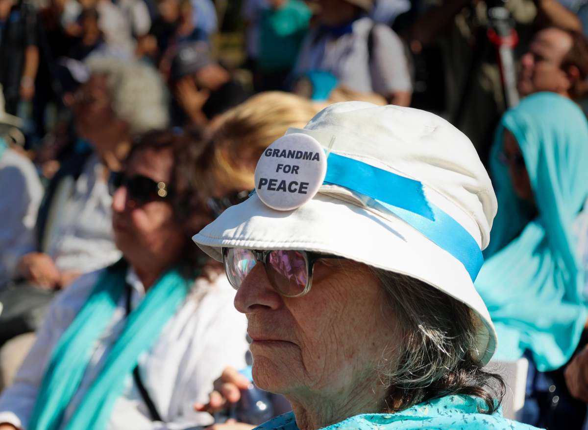 A woman wears a button that says "Grandma's for Peace" at the funeral of Israeli-Canadian Peace Activist Vivian Silver on November 16, 2023.