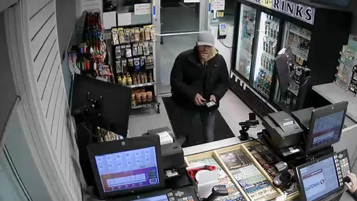 Calgary Police seek suspect in poppy box theft.