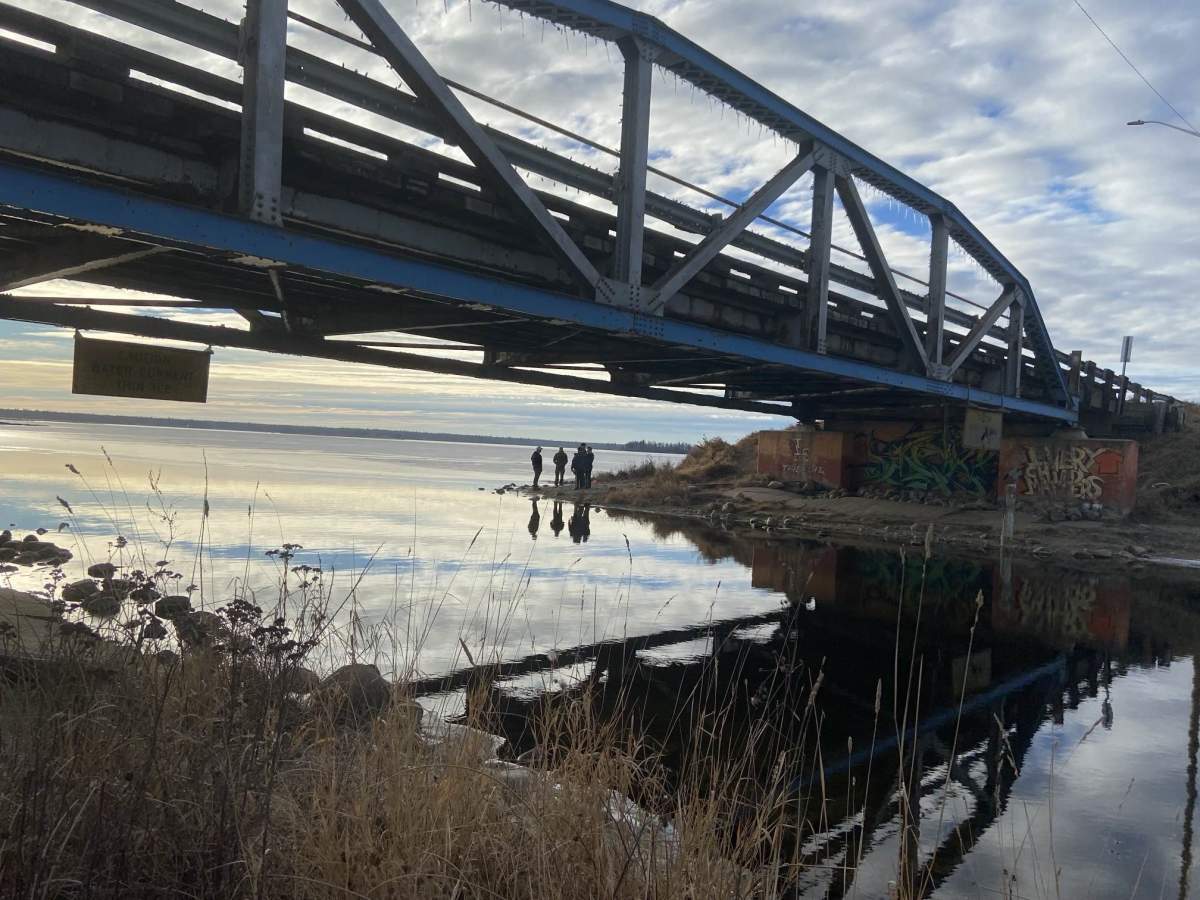 RCMP and dive teams search Lac Ste. Anne, Alta., for a missing family on Dec. 26, 2023.