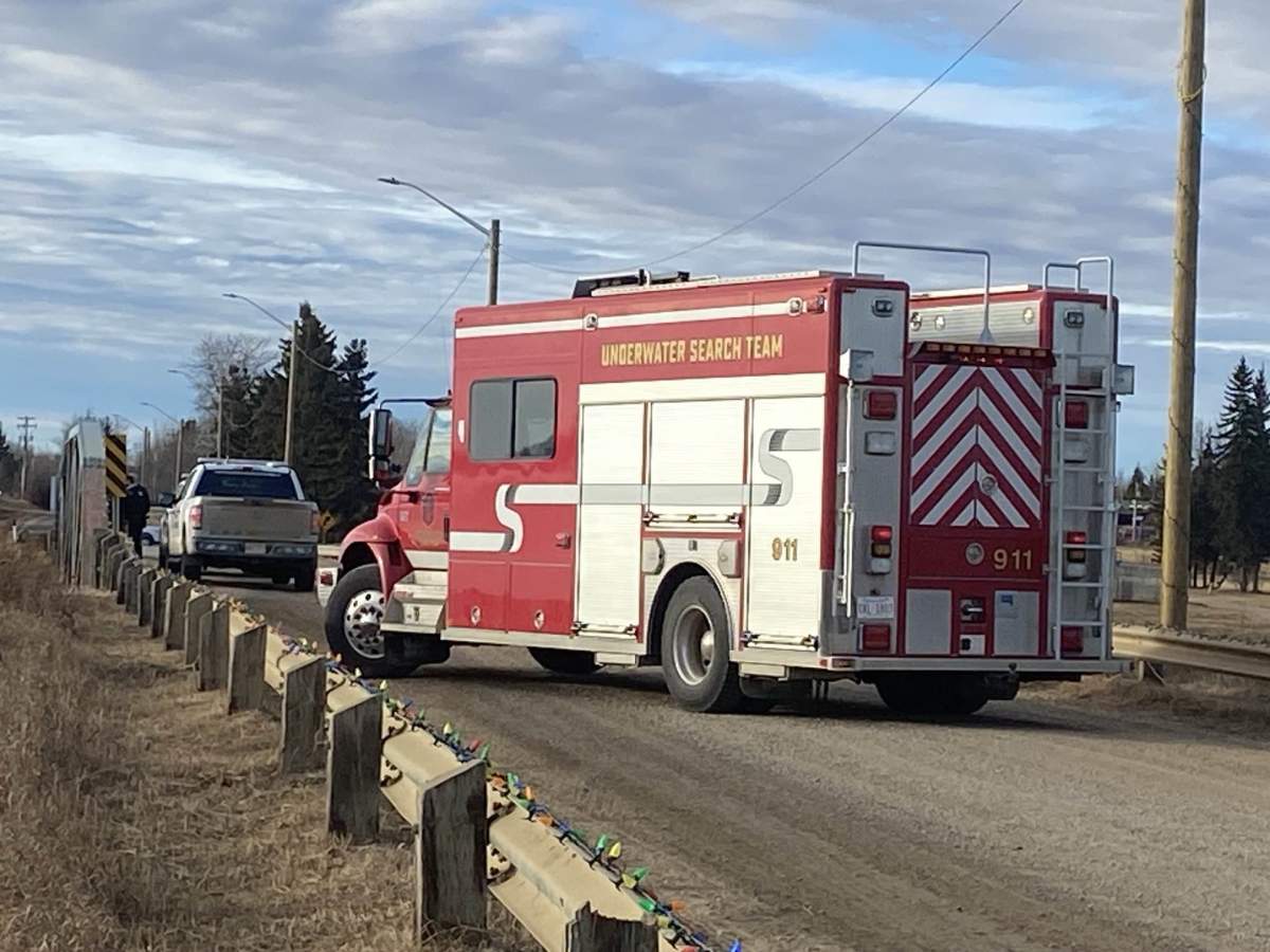 RCMP and dive teams search Lac Ste. Anne, Alta., for a missing family on Dec. 26, 2023.