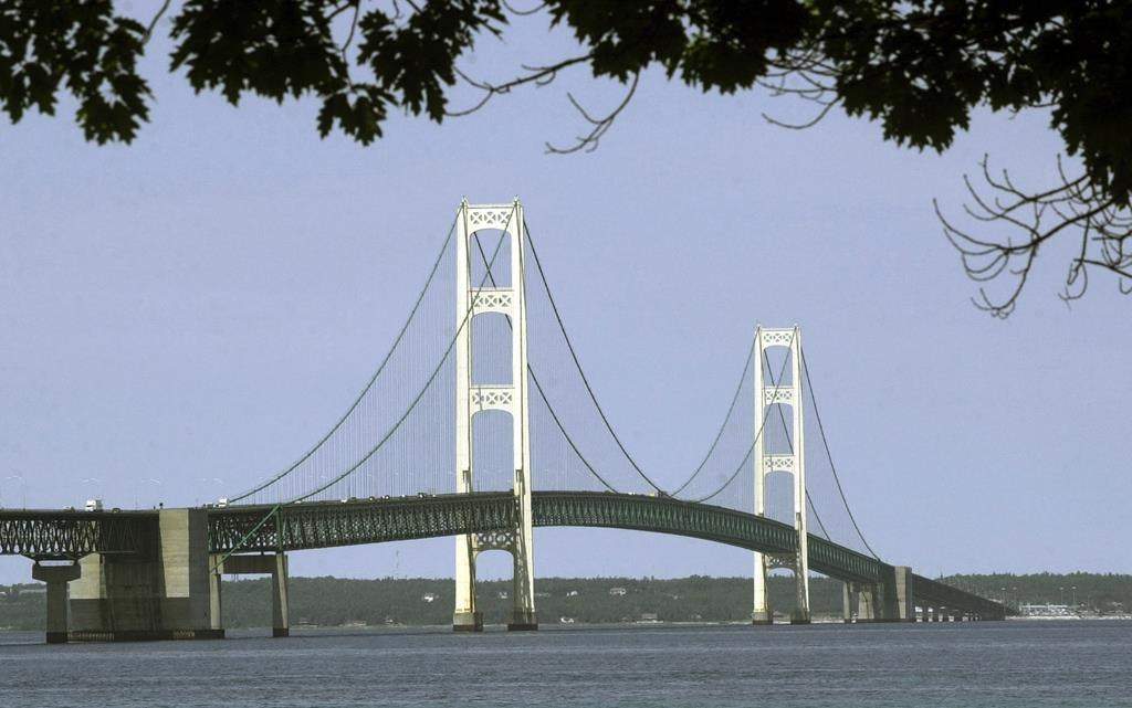 FILE - This July 19, 2002, file photo, shows the Mackinac Bridge that spans the Straits of Mackinac from Mackinaw City, Mich. Michigan regulators have approved a $500 million plan to encase a portion of an oil pipeline that runs beneath a channel connecting two Great Lakes. The state Public Service Commission on Friday, Dec. 1, 2023, approved the proposal for the tunnel through the Straits of Mackinac.