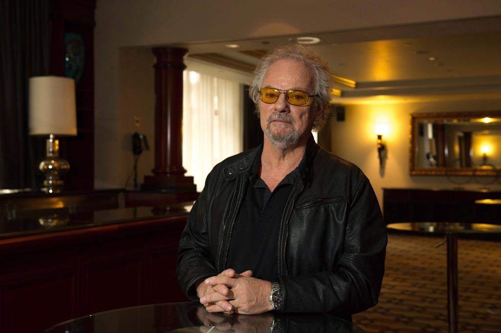 Myles Goodwyn poses for a portrait while promoting his memoir "Just Between You and Me," in Toronto, Friday, Nov. 25, 2016.
