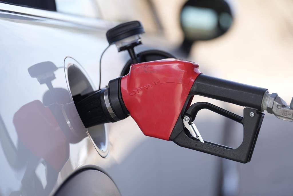 A close up image of a gas pump in a vehicle.