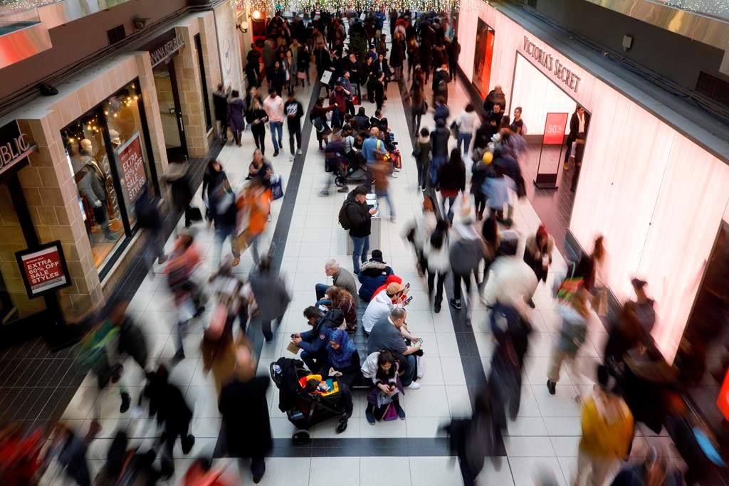 Shoppers are seen at Toronto Eaton Centre during Boxing Day in Toronto, Thursday, Dec. 26, 2019. 