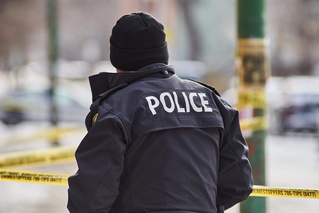 Winnipeg police say an officer shot an armed man in a University Crescent apartment on New Year's Eve.