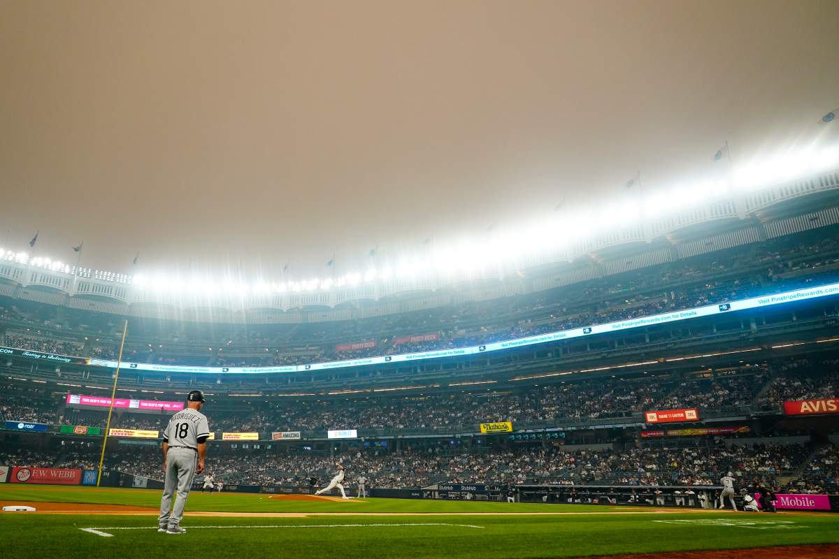 New York Yankees’ Clarke Schmidt pitches to Chicago White Sox’s Tim Anderson during the first inning of a baseball game Tuesday, June 6, 2023, in New York. Smoke from Canadian wildfires has traveled into the United States, resulting in a number of air quality alerts issued since May. (AP Photo/Frank Franklin II)