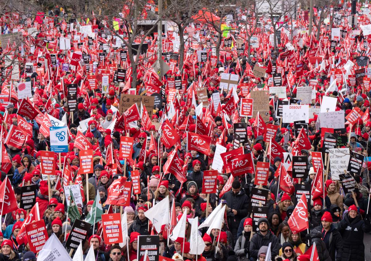 Members of the FAE teachers union march to begin their unlimited strike, Thursday, Nov. 23, 2023 in Montreal.
