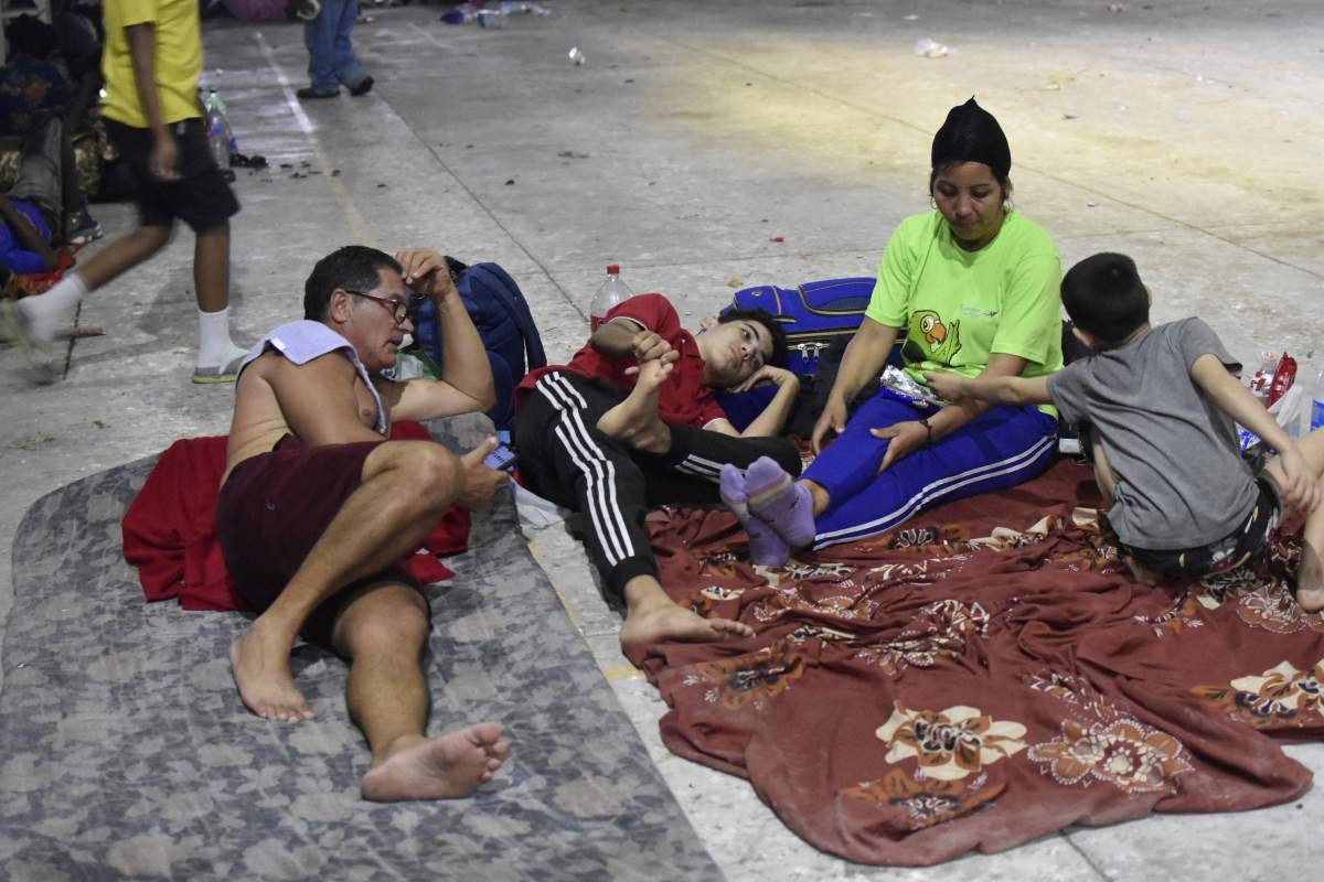 Migrants camp in Alvaro Obregon, Mexico, Sunday, Dec. 24, 2023. A caravan or migrants started the trek north from Tapachula on Sunday, just days before U.S. Secretary of State Antony Blinken arrives in Mexico City to discuss new agreements to control the surge of migrants seeking entry into the United States. (AP Photo/Edgard H. Clemente)