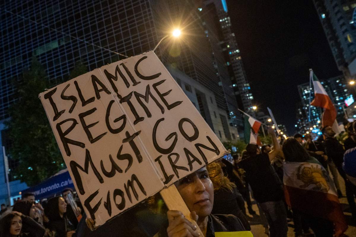 The Freedom Rally for Iran, in support of Mahsa Amini, continues into the evening at Mel Lastman Square in Toronto on Oct. 1, 2022. THE CANADIAN PRESS IMAGES/Dominic Chan